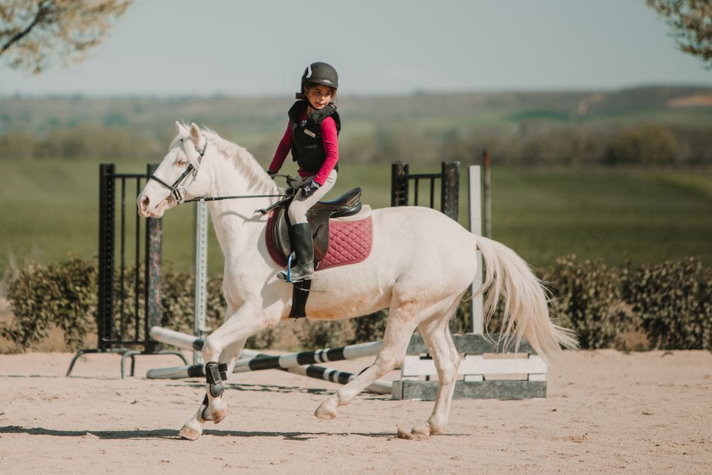 Girl riding horse