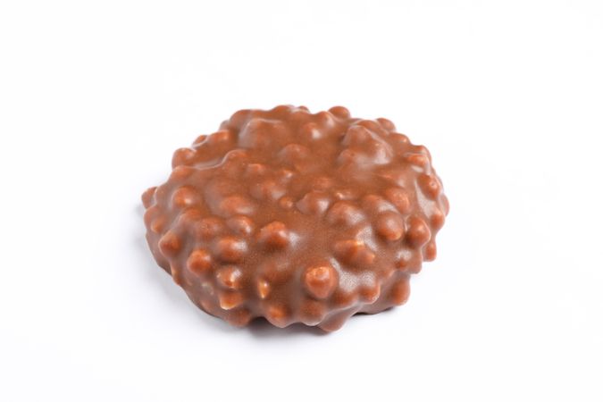 Chocolate cookie with caramel filling on studio background