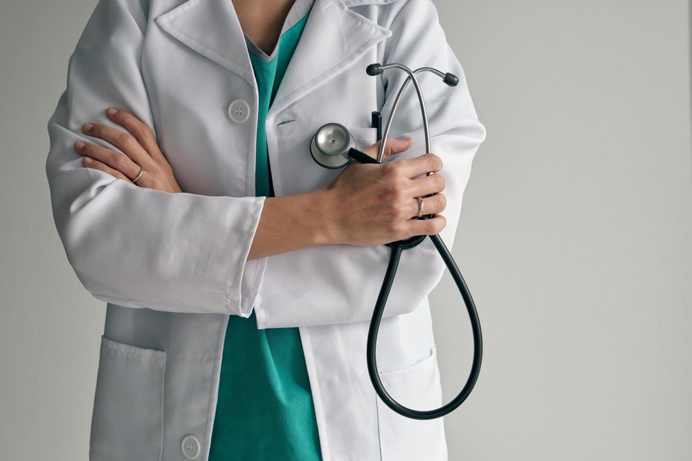 Crop doctor in medical robe with stethoscope