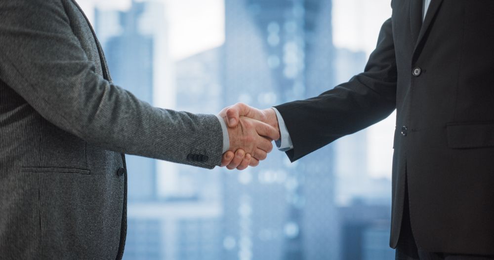 Corporate CEO and Investment Manager Handshake on a Lucrative Financial Opportunity.
