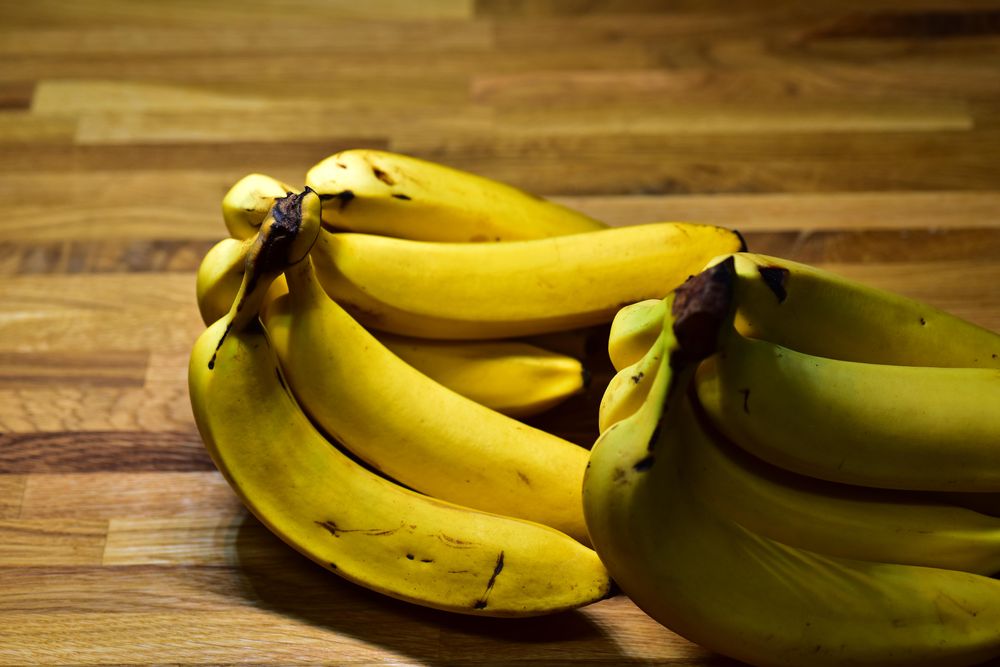 Yellow banana on a wooden table.
