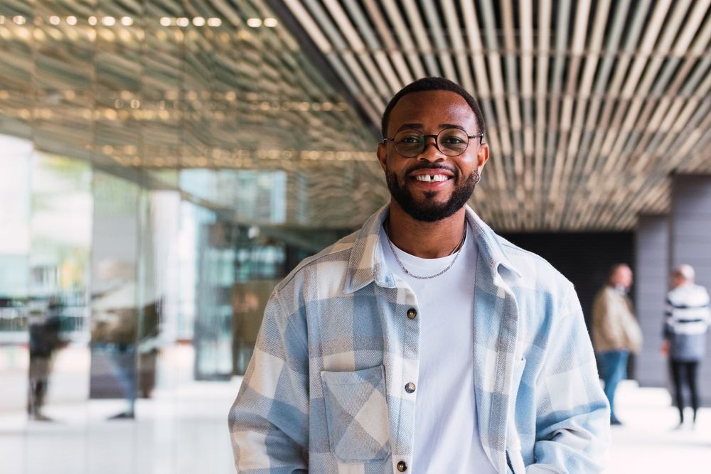 Cheerful Black man on street