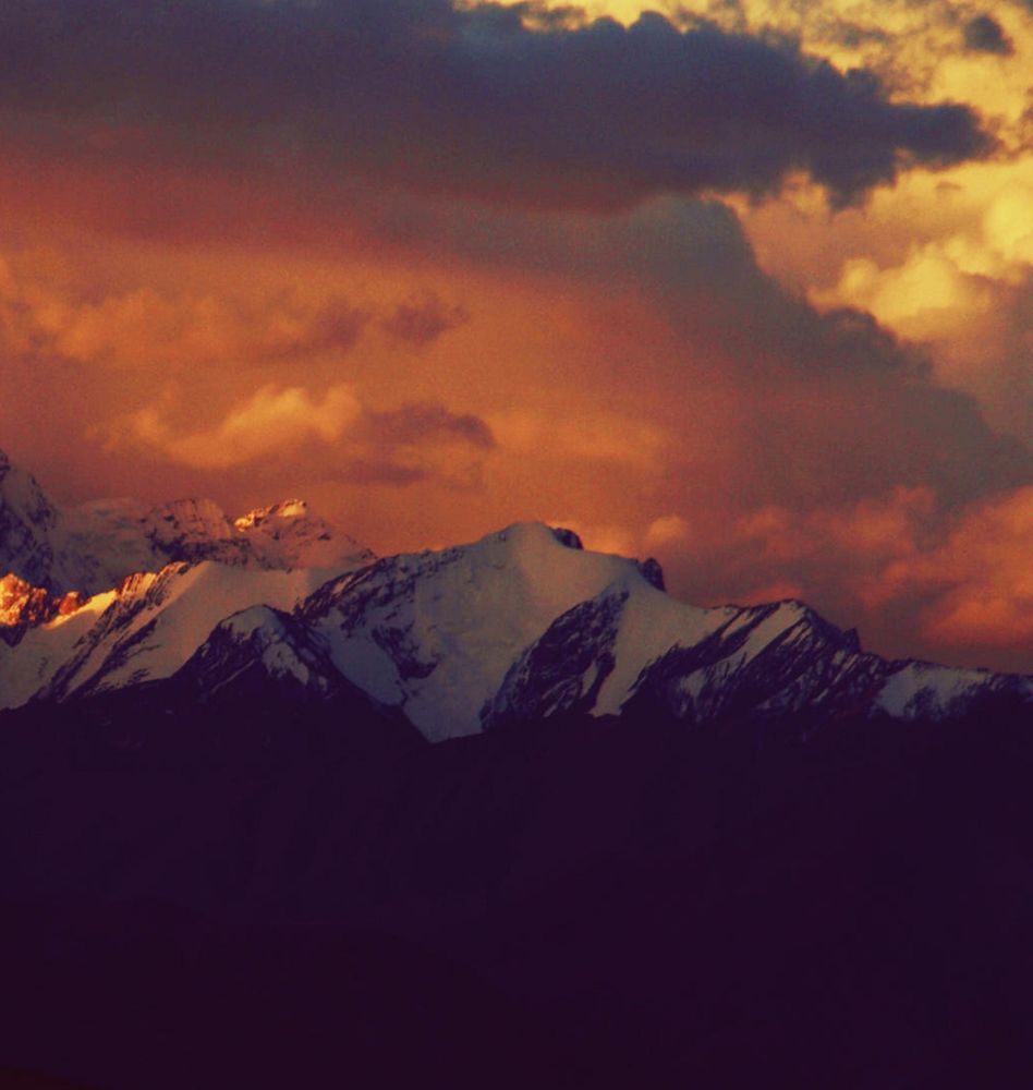 Snow covered mountain during sunset in Tibet