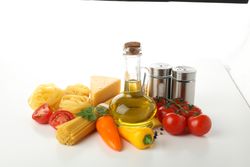 Composition with pasta and ingredients for cooking isolated on plain background