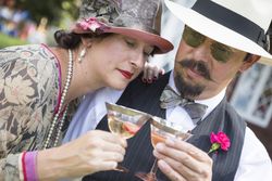 Couple in 1920’s Era Fashion Sipping Champagne