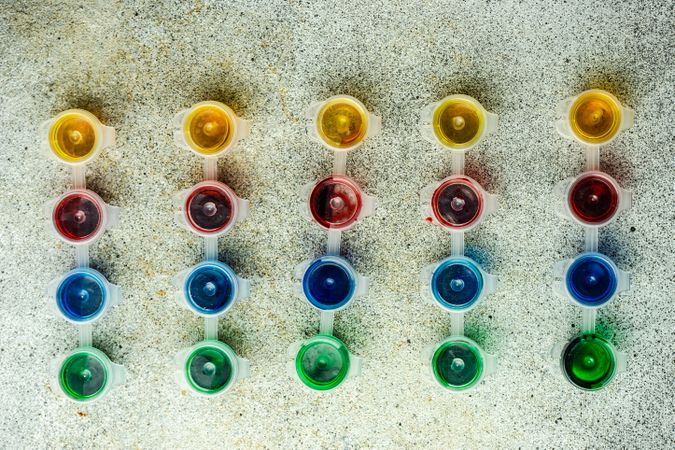 Top view of paints on concrete background
