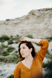 Dreamy young woman posing outdoors