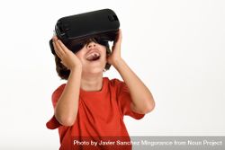 Smiling girl in VR glasses and gesturing with hands on goggles 4AaAm4