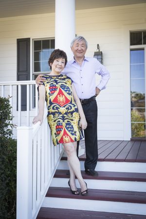 Smiling Chinese Couple Enjoying Their House