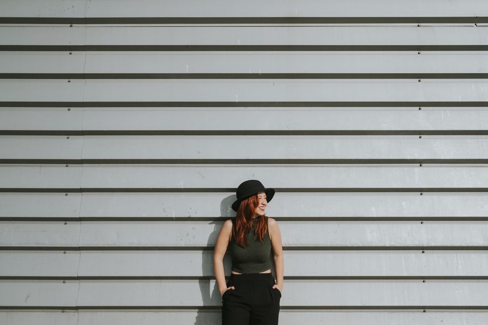 Woman leaning on wall