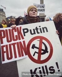 London, England, United Kingdom - March 5 2022: Woman with anti Putin sign in Trafalgar Square 4dzqQ0