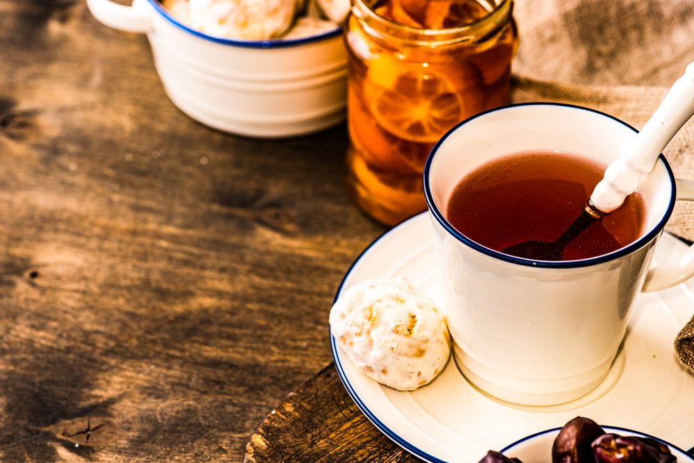 Warming cup of tea with cookie