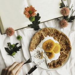 Crepes with cream and persimmon