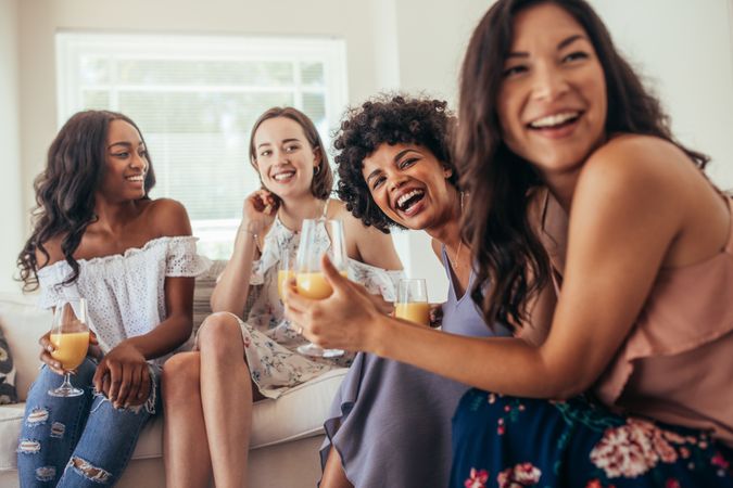 Diverse group of female friends enjoying at a party