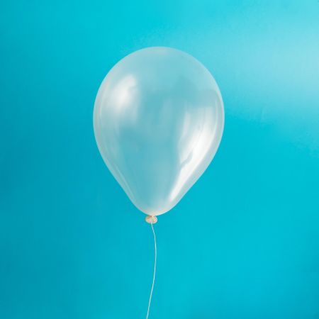 Clear balloon on blue background