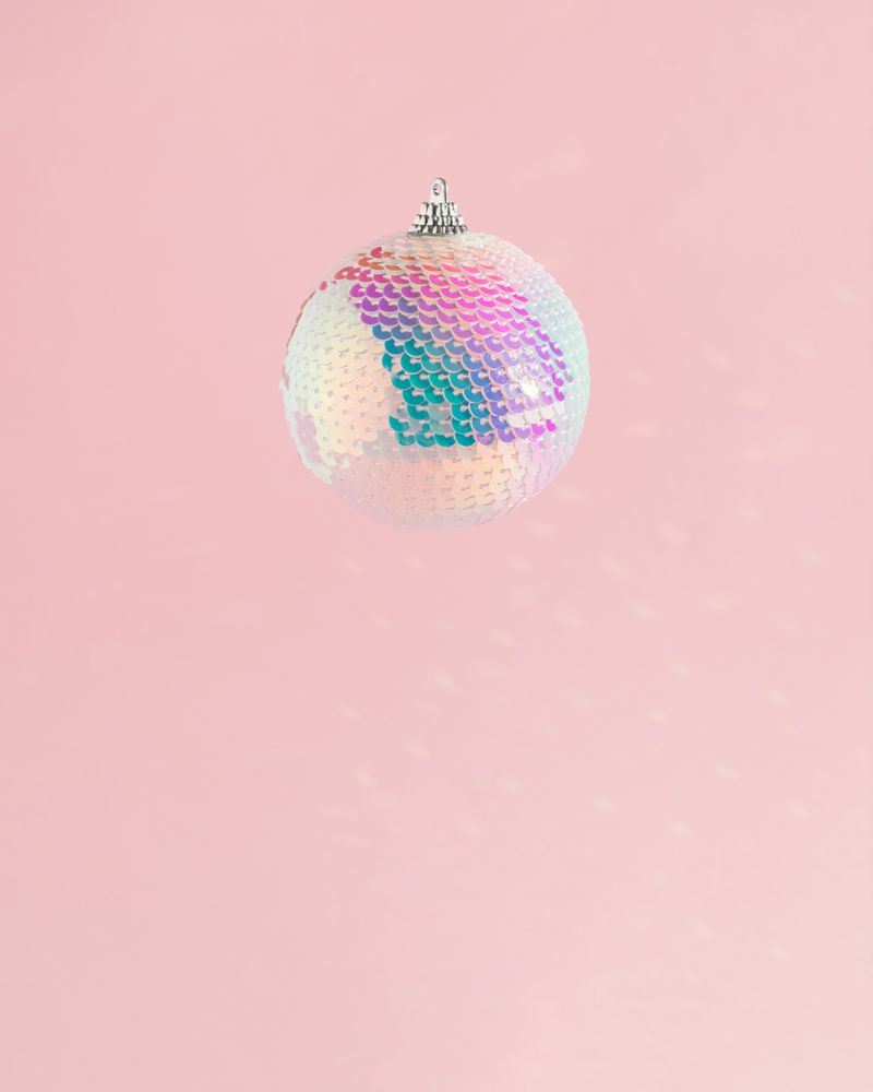 Sequins bauble on pink background