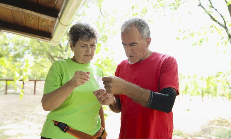 Mature couple reading the instructions.