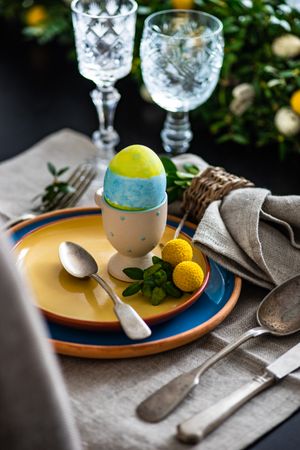 Easter table setting with colorful egg
