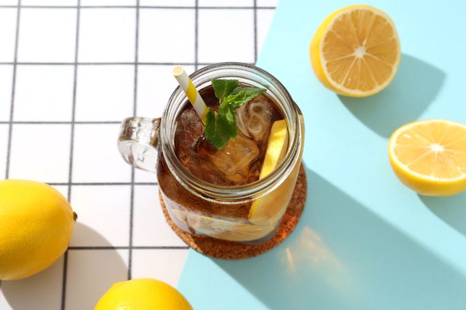 A glass of cold tea with fresh orange slices