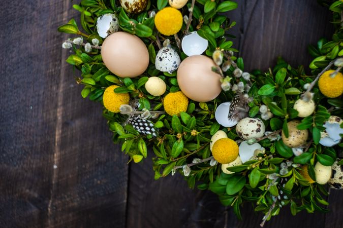 Easter card concept with seasonal wreath on wooden door