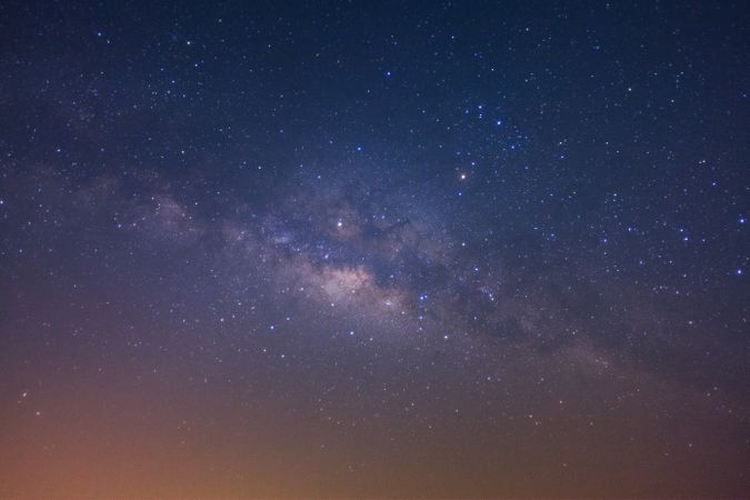 The milky way galaxy with stars and space dust in the universe, Long exposure photograph, with grain