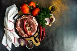 Top view of fresh raw pork ready to be cooked for dinner with copy space