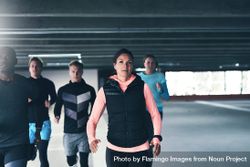 Group of athletic men and women running in concrete space 493960