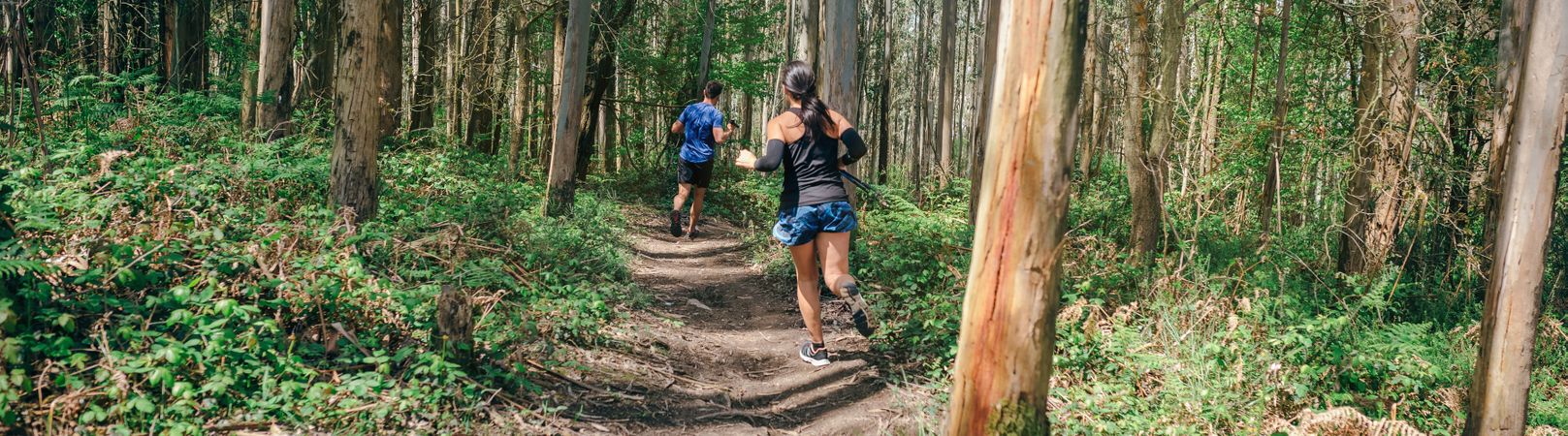 Young woman and man doing trail