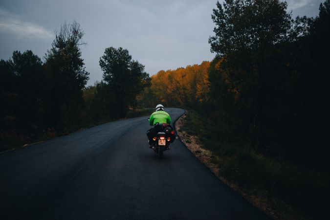 Motorcycle on mountainous road at dusk