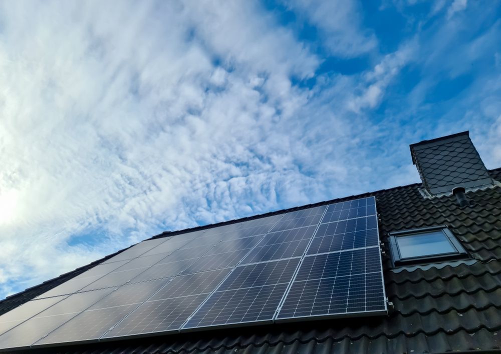 Solar panels producing clean energy on a roof of a residential house