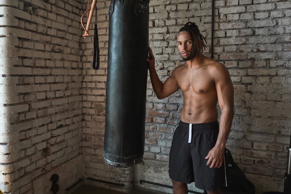 Confident Black boxer in gym