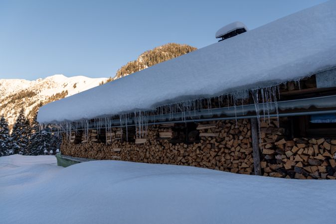 Snow-covered mountain cabin in an alpine scenery in Bavaria, Germany