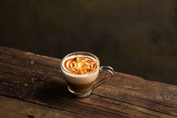 Cups of tasty hot coffee drink on wooden table