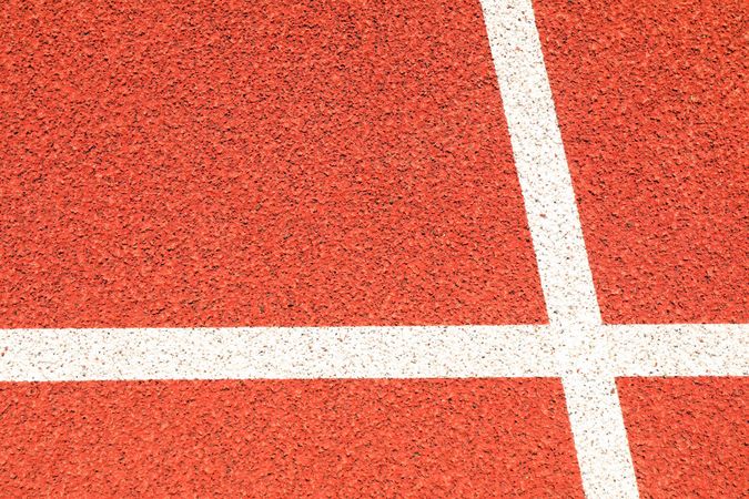 Red running track with lines outdoor, copy space