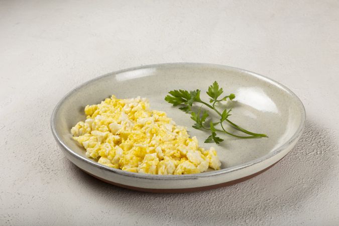 Breakfast with scrambled eggs on the table.