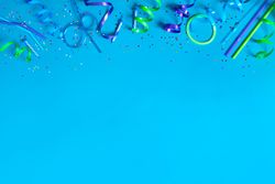 Party streamers on bright blue background