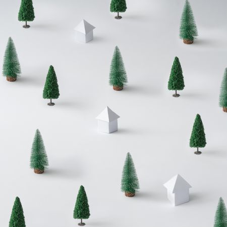 Winter landscape made of Christmas trees and paper houses