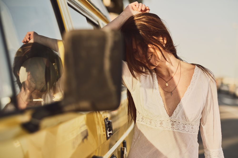 Young woman on a yellow van