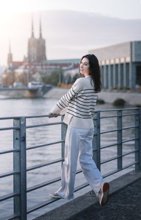Young woman in trendy summer  clothes at sunset