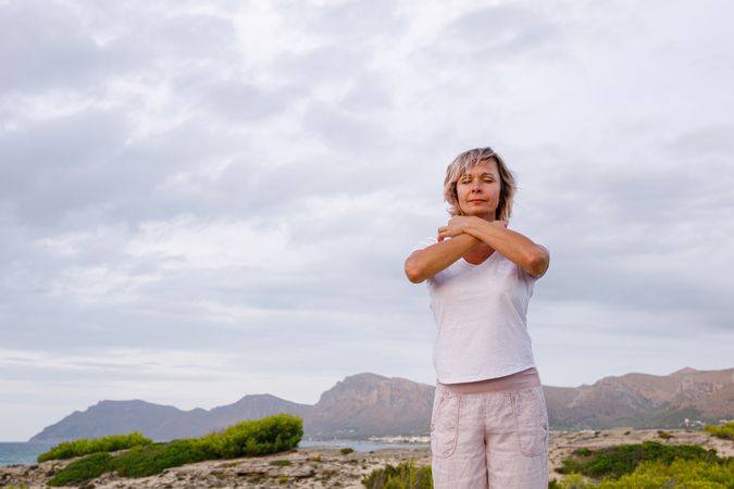 Adult woman doing breathing exercise