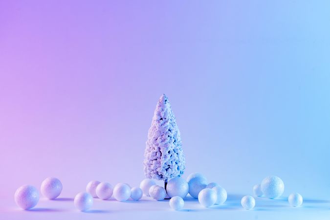 Snowy Christmas tree and baubles in vibrant bold gradient holographic colors