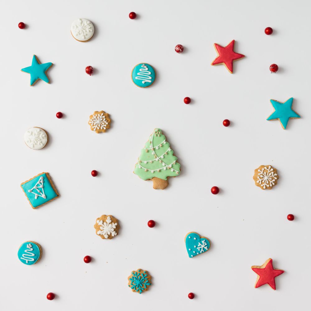 Christmas cookies and red berries with tree cookie