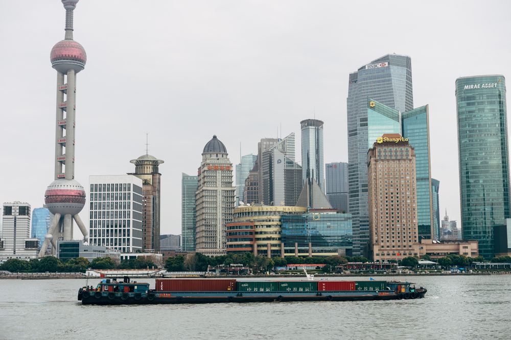 Boat in river near Jin Mao Tower in the city of Lujiazui, Pudong, Shanghai, China