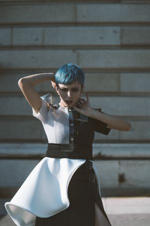 Expressive model in alternative dress on street