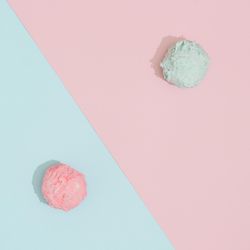 Ice cream scoops on pastel pink and blue background