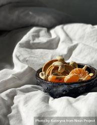 Health breakfast bowl on bedsheets in morning light 0LeEg5