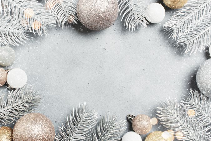 Silver Christmas flatly with frosted pine cones and baubles