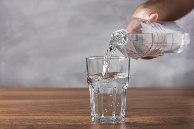 Glass of fresh water on the table.
