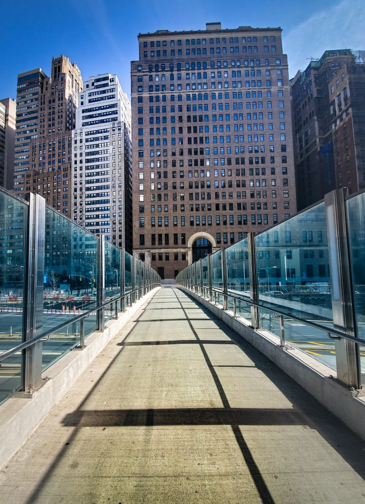 Gray concrete pathway near buildings