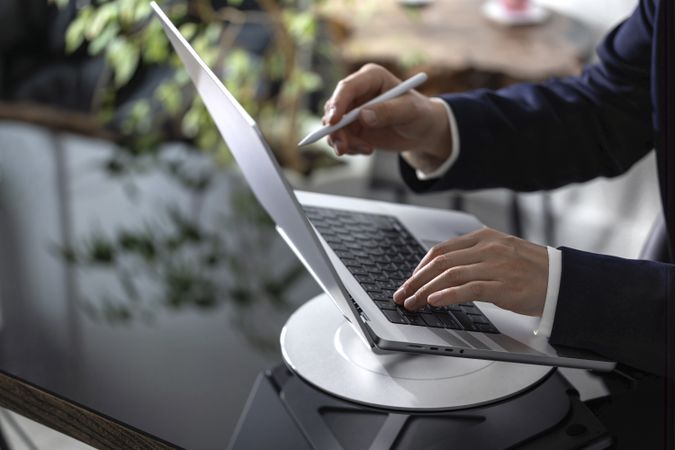 Businessman Working on Laptop at Office Desk